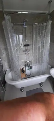 a bathroom sink with water pouring out of it at Conkers Cottage in Forden