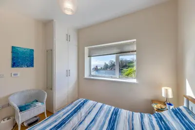 a bedroom with a bed and a window at 2 Bed in Aberdovey oc-n30627 in Aberdyfi