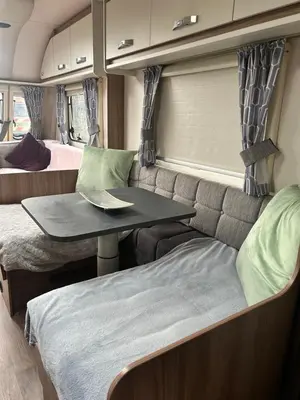 a small table in the back of an rv at Carol Anns Caravan, Working Farm Stay, Rural, Private, Fire Pit for hire, Dogs on request in Pontesbury