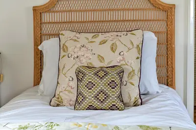 a pillow sitting on top of a bed at Finest Retreats - Moelis Barn in Llandrillo