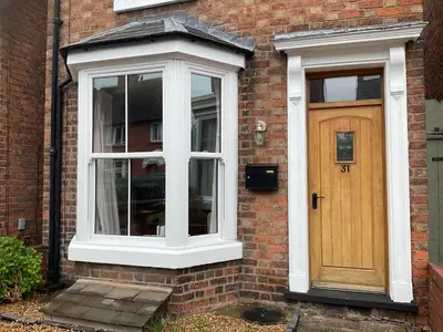 a brick house with a door and a window at Little Hotspur in Shrewsbury