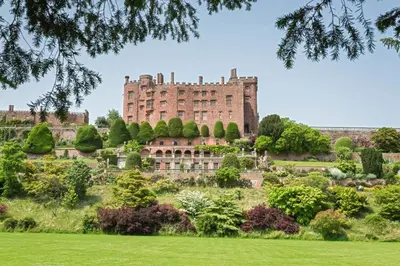 a large castle on a hill with a garden at 2 Bed in Llangedwyn oc-l30530 in Llangedwyn