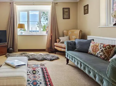 a living room with a couch and a window at 3 Bed in Leominster oc-r30485 in Yarpole