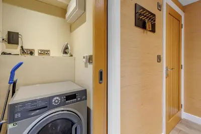 a laundry room with a washing machine in a room at 4 Bed in Llansanffraid oc-k30383 in Llanymynech