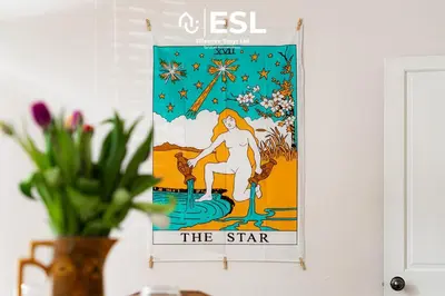 a poster of a woman sitting on a chair on a wall at 2 Bed Townhouse with Garden & Parking in Shrewsbury