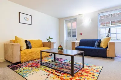 a living room with two couches and a coffee table at 2 bedroom apartment - Shrewsbury town centre in Shrewsbury