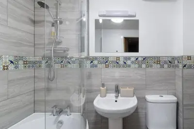 a bathroom with a toilet and a sink and a shower at 2 bedroom apartment - Shrewsbury town centre in Shrewsbury