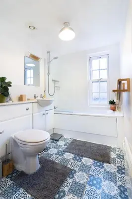a bathroom with a toilet and a sink and a tub at 1-bedroom apartment Shrewsbury town centre in Shrewsbury