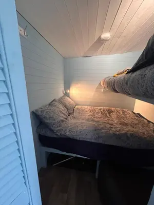 a small room with two beds in it at Bon yr Llew, Coity Bach in Brecon