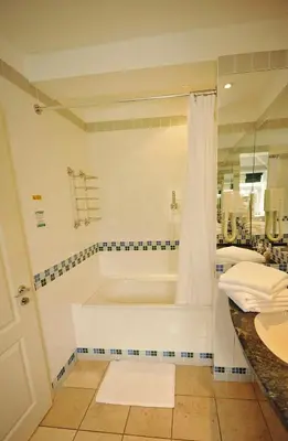 a bathroom with a tub and a sink at The Castle Hotel in Talgarth