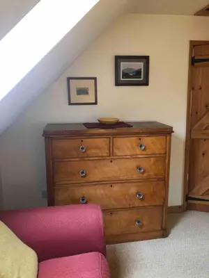 a wooden dresser with a bowl on top of it at Detached cottage in the hills near Dolgellau in Cross Foxes