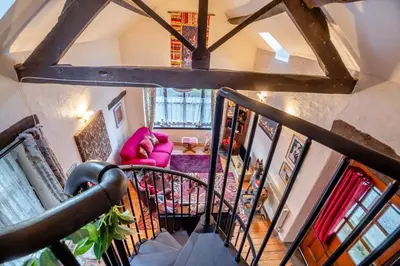 an overhead view of a living room with a pink couch at 1 Bed in Llandderfel oc-t30475 in Llandderfel