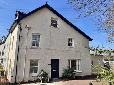 a white house with a black roof at 4 Bed in Brecon oc-h30823 in Brecon