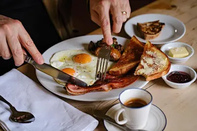 a plate of breakfast food with eggs and toast at The Bridges in Shrewsbury