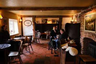 a group of people sitting in a room with their dogs at The Bridges in Shrewsbury