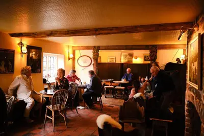 a group of people sitting at tables in a restaurant at The Bridges in Shrewsbury