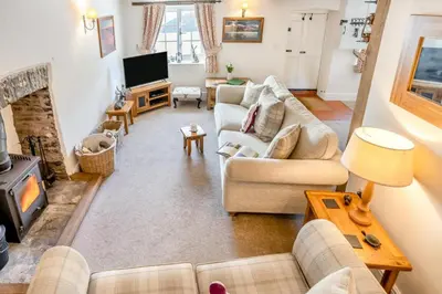 a living room with two couches and a fireplace at 2 Bed in Trecastle oc-c30837 in Trecastle