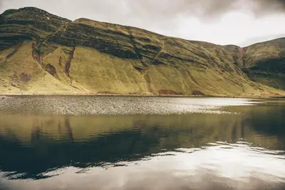 a mountain reflecting in a body of water at 2 Bed in Trecastle oc-c30837 in Trecastle