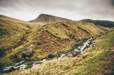 a mountain with a river on the side of it at 2 Bed in Trecastle oc-c30837 in Trecastle