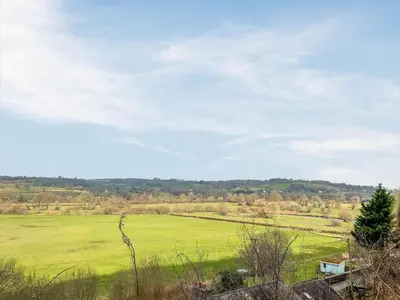 a field of green grass with a blue sky at The Cabin In The Woods - Uk49023 in Pencarreg