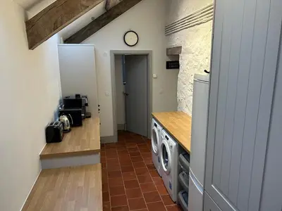 a kitchen with a washer and dryer in a room at Beautiful Remote Cottage near Dolgellau in Penmaen Pool