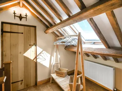 a room with a ladder and a window at Aberserw Cottage in Trawsfynydd