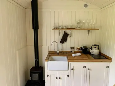 a kitchen with a sink and a stove at Tower Farm Holidays in Llangollen