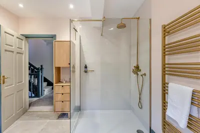 a bathroom with a shower with a glass door at 5 Bed in Church Stretton oc-t30413 in Church Stretton