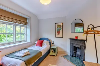 a bedroom with a bed and a fireplace at 5 Bed in Church Stretton oc-t30413 in Church Stretton