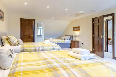 two beds in a room with two beds at 2 Bed in Llangorse oc-t30290 in Llangorse