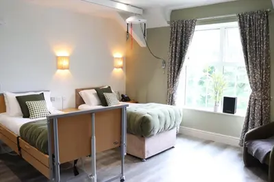 a bedroom with two beds and a window at Gwesty Seren Hotel in Blaenau-Ffestiniog