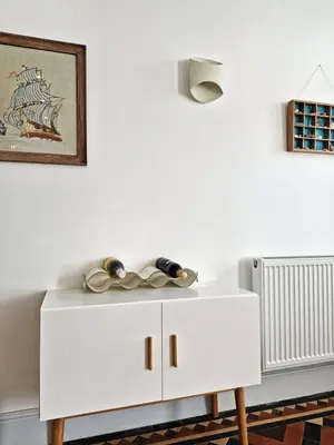 a white cabinet with two pairs of scissors on it at Green Hill ground floor Family Apartment in Barmouth