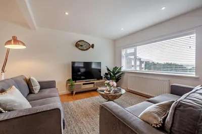 a living room with a couch and a flat screen tv at 3 Bed in Aberdovey oc-n29124 in Aberdyfi