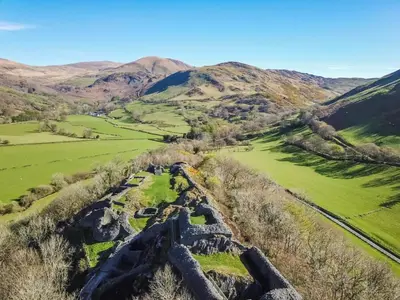 an aerial view of the ruins of the incan fortress in the hills at 2 Bed in Rhoslefain oc-i30763 in Llangelynin