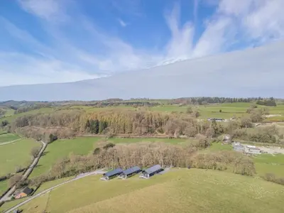 an overhead view of a farm with houses in a field at 1 Bed in Berriew oc-a31113 in Berriew