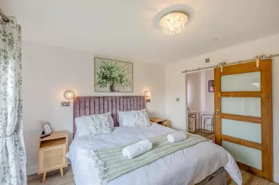 a bedroom with a bed with two pillows on it at 4 Bed in Berriew oc-t31114 in Berriew