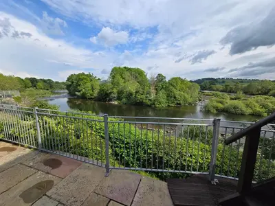 a view of a river from a balcony at The Loft at Box Bridge in Brecon