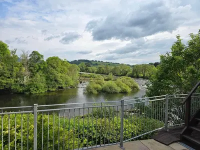 a view of a river from a bridge at The Loft at Box Bridge in Brecon