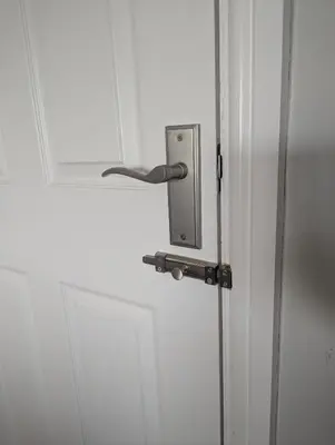 a door with a metal handle on a white door at Number 46 in Bicton
