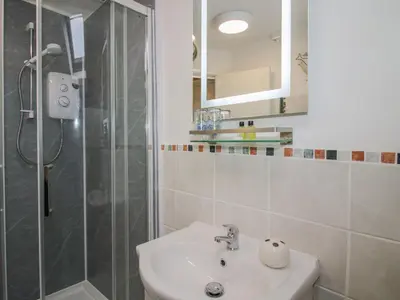 a bathroom with a sink and a shower at The Millers Roost at Dudgeley Mill in Church Stretton