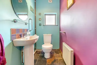 a bathroom with a white toilet and a sink at 5 Bed in Ystrad Meurig oc-r31133 in Ystrad Meurig