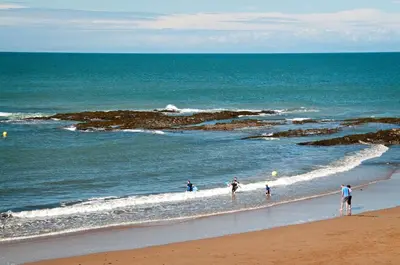 a group of people walking on the beach at 5 Bed in Ystrad Meurig oc-r31133 in Ystrad Meurig