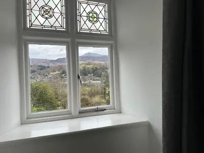 an open window with a view of the mountains at Cil-y-Coed in Dolgellau