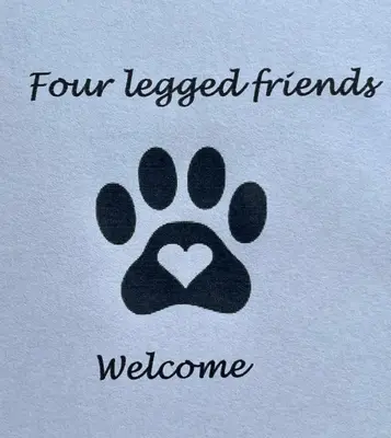 a paw print with a heart and the words four legged friends welcome at The Old Smithy, beautifully restored cottage in Carreghofa, near Llanymynech in Llanymynech