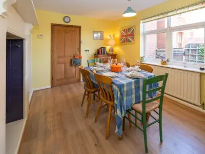 a kitchen and dining room with a table and chairs at Quintessentially English 3-Bed Home in Ludlow - Pass the Keys in Ludlow