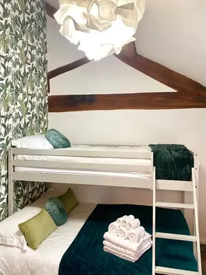 a bunk bed room with two bunk beds at North Cottage in Berriew