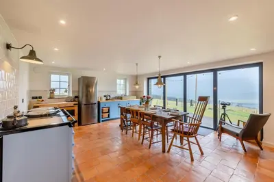 a kitchen and dining room with a table and chairs at 4 Bed in Llangower oc-f31072 in Llangower
