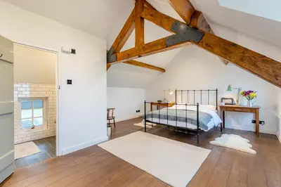 a bedroom with a bed in a attic at 4 Bed in Llangower oc-f31072 in Llangower