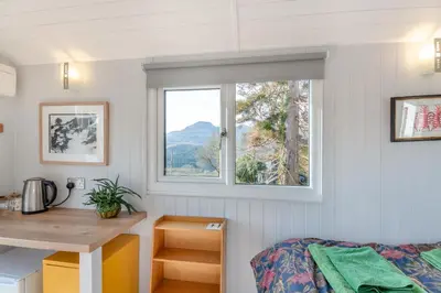 a small bedroom with a desk and a window at 1 Bed in Ffestiniog oc-c31093 in Ffestiniog