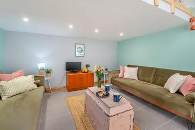 a living room with two couches and a tv at 1 Bed in Ffestiniog oc-c31093 in Ffestiniog
